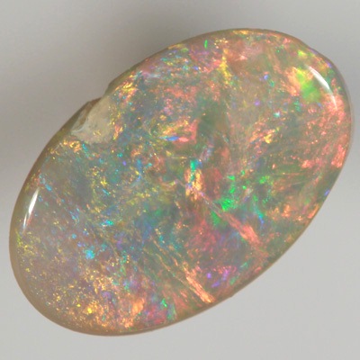 SOLID SEMI BLACK OPAL Bright, sparkly red and orange over green and blue